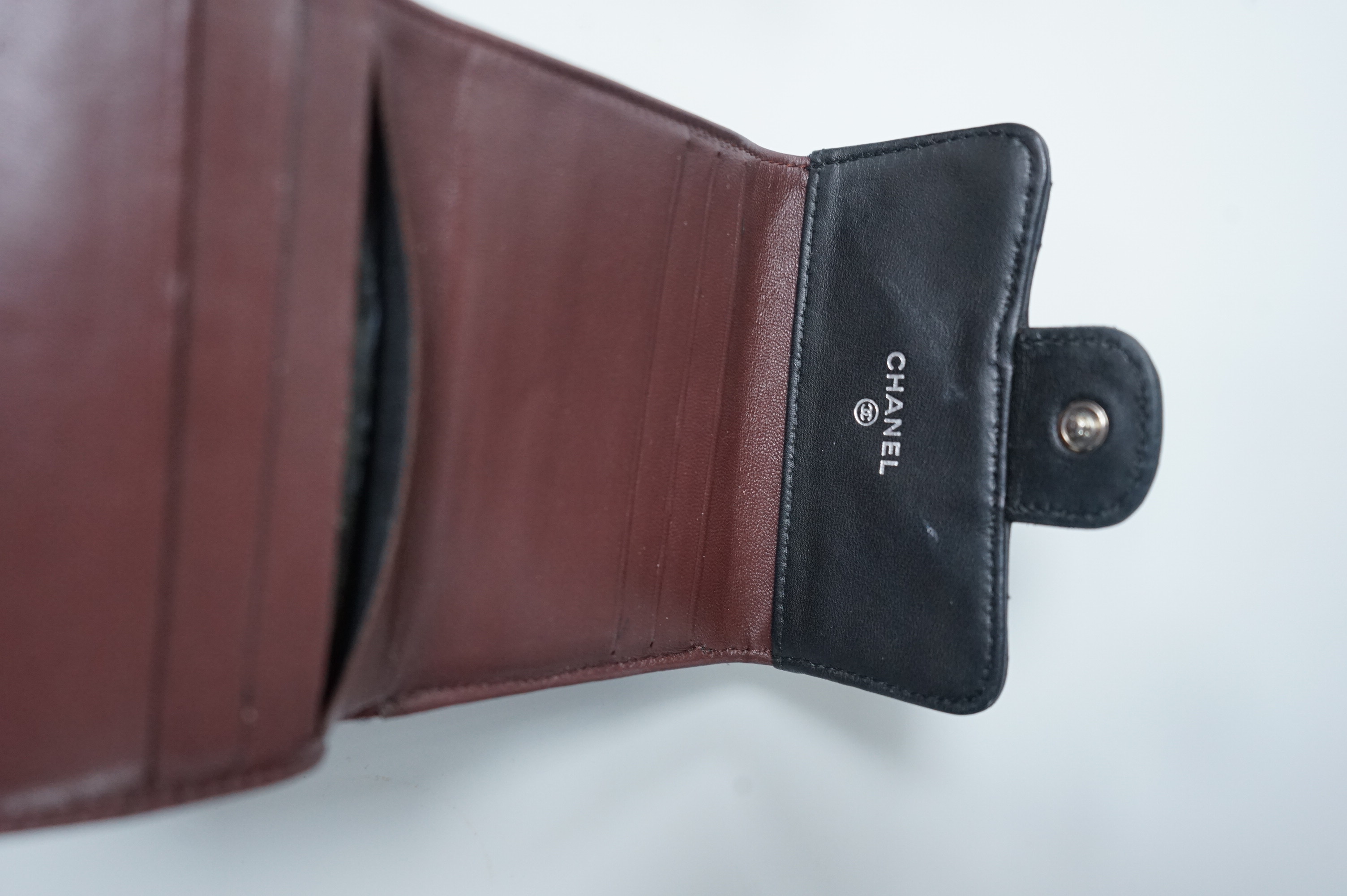A Chanel classic double flap black leather purse, with original receipt, authenticity card numbered 10670211 and box, 10cm wide, Provenance: Purchased by the vendor in New York